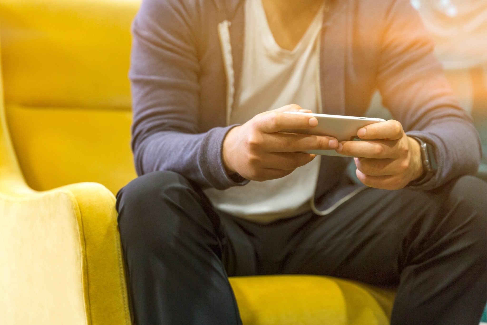 Photography of man using mobile phone