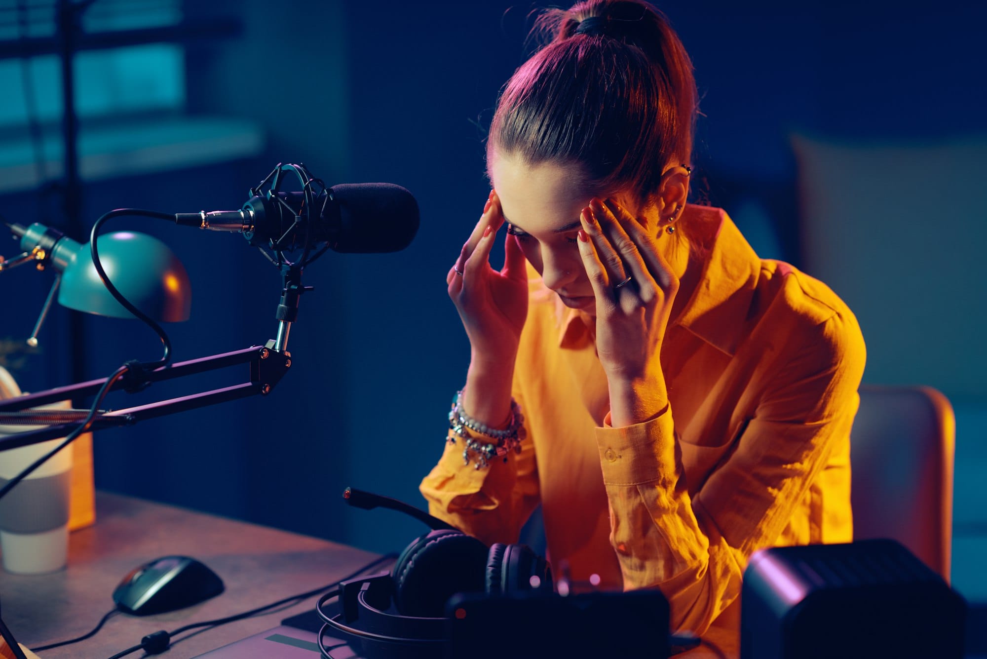 Tired radio host with headache