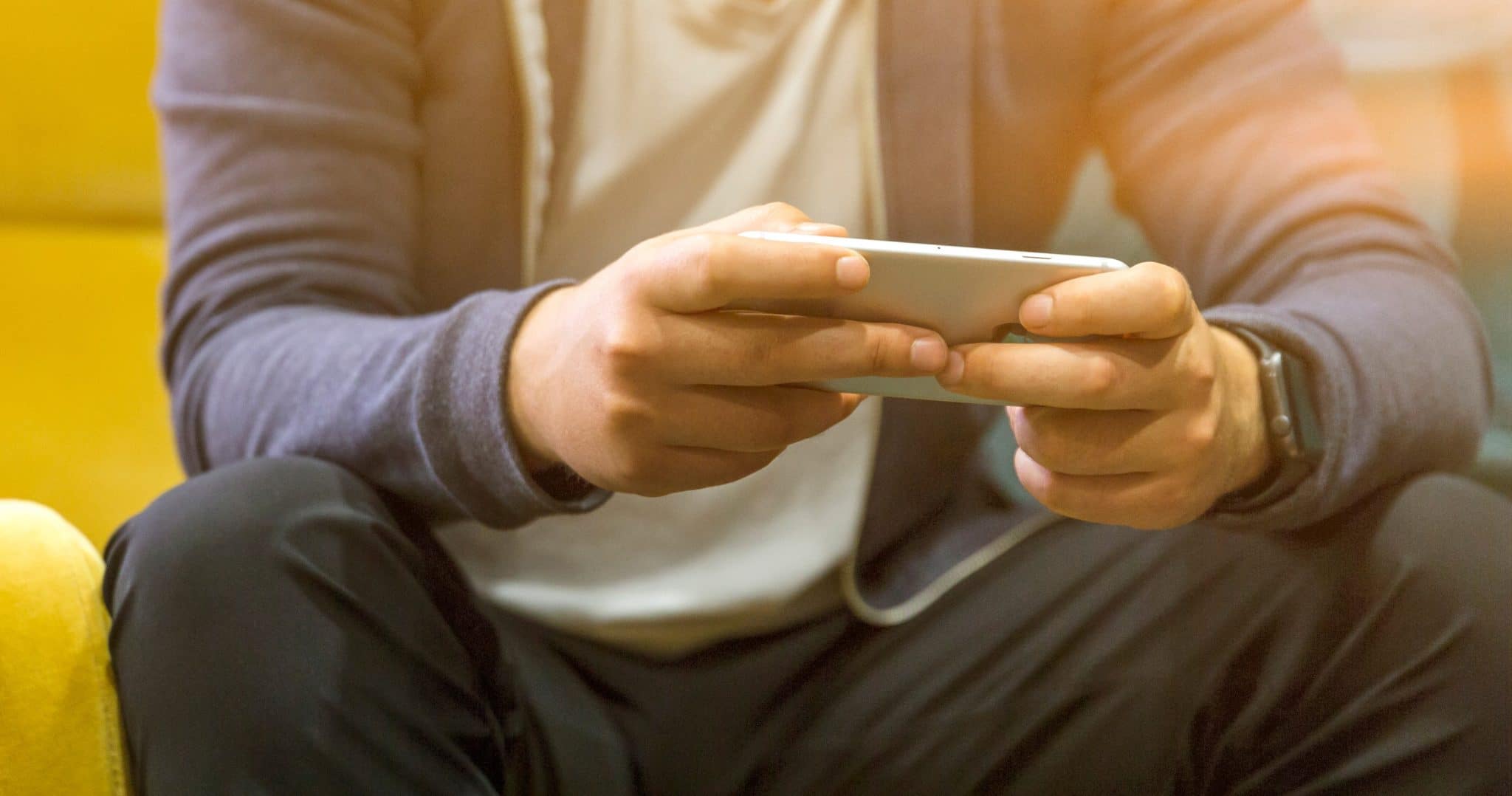 Photography of man using mobile phone
